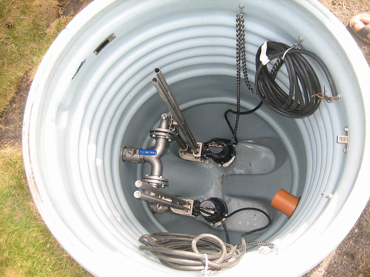 Sump pit with pumps and piping, viewed from above